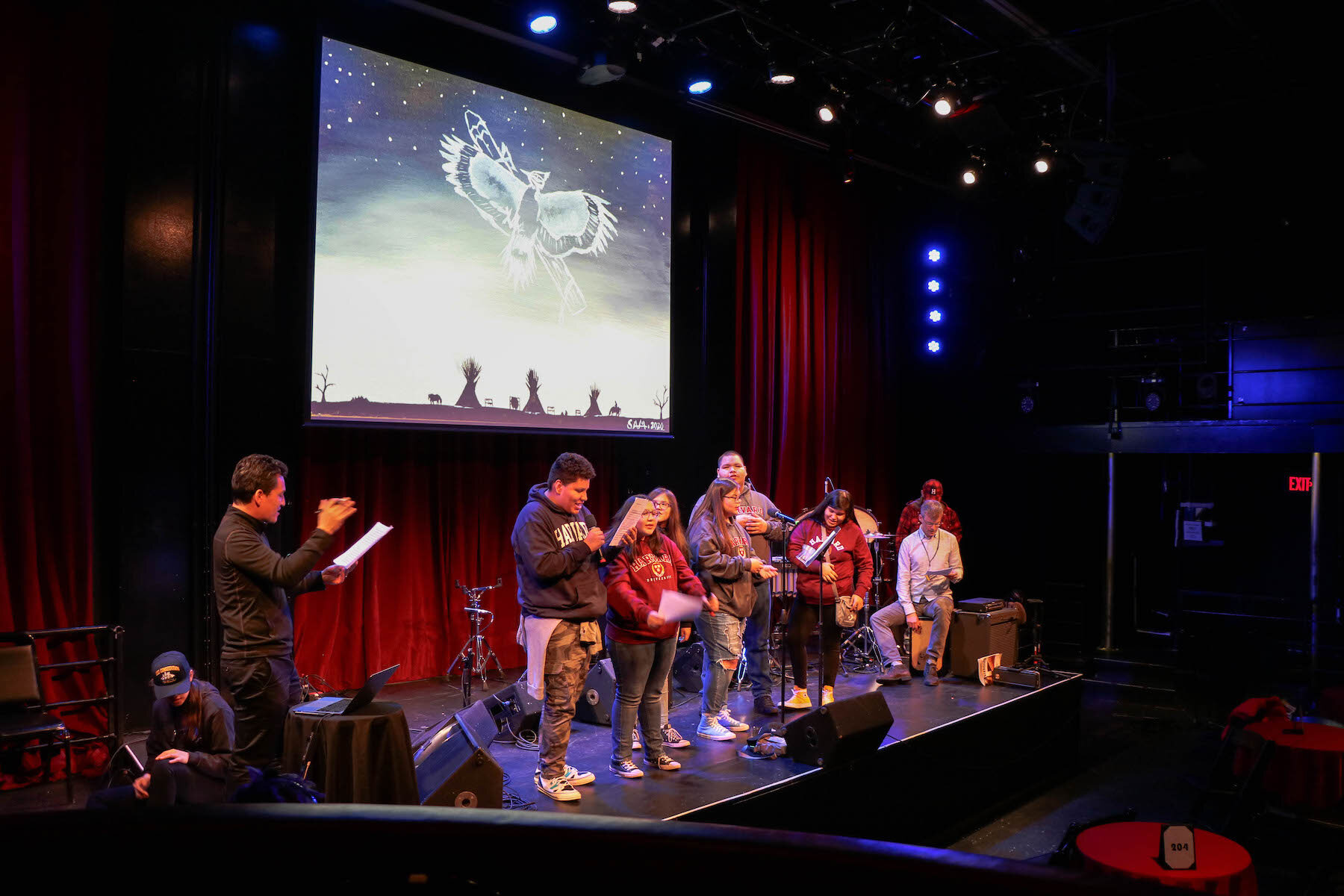People singing on a stage